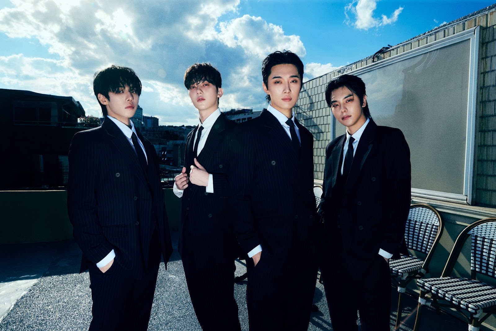 The OXN members in black suit and tie attire.