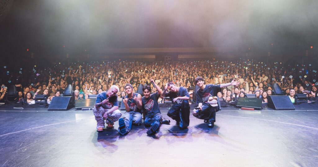 SB19 taking a picture with their audience at their LA show, July 13 2025