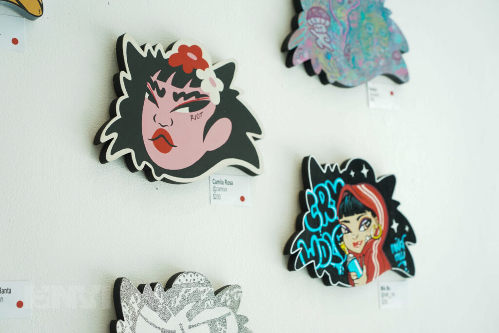 Two paintings created on a board shaped like the head of Dante, Jappy Agoncillo's wolf character.