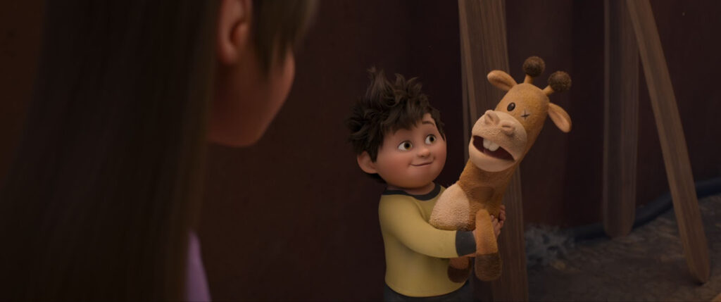 Elliot holding his giraffe plushie, Baloney Tony.