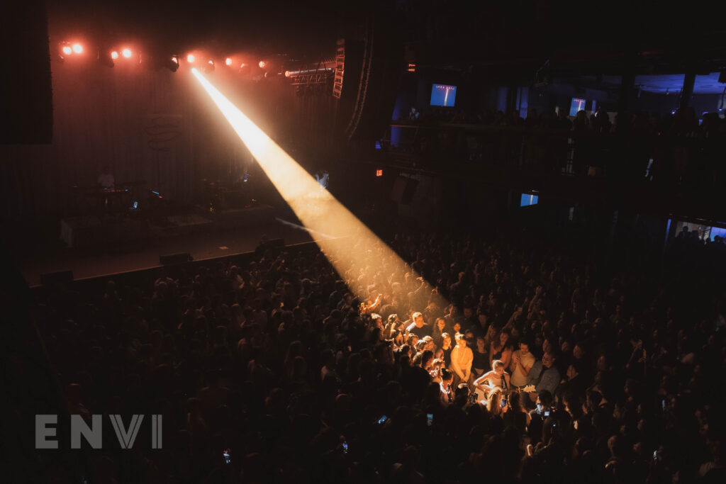 Pop singer-songwriter Griff performing amidst the crowd at her headlining show at NYC's Terminal 5