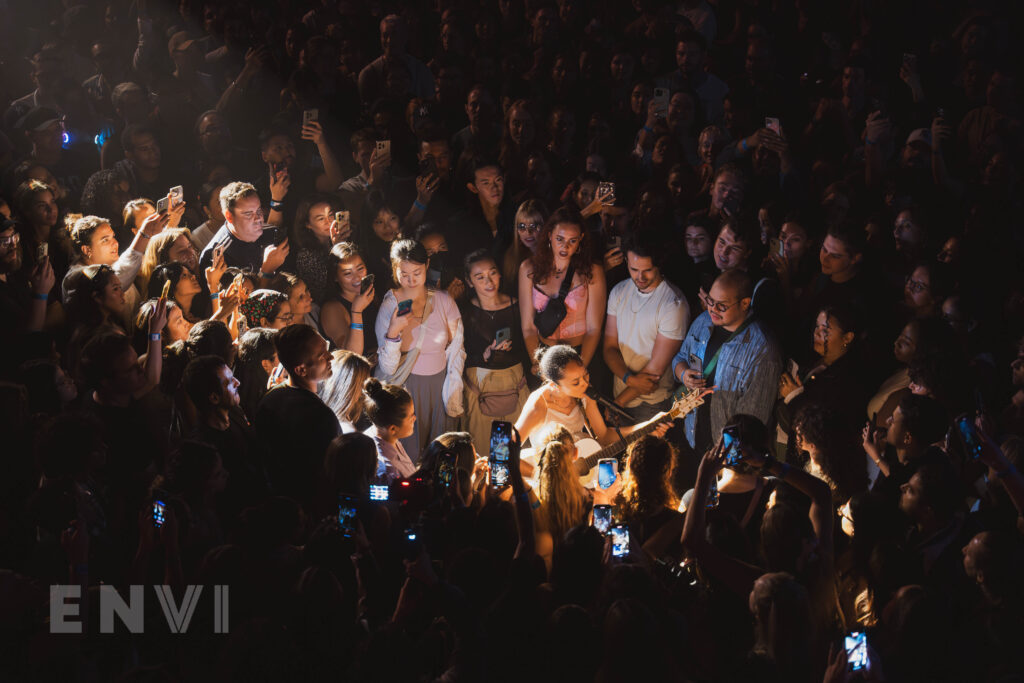 Pop singer-songwriter Griff performing amidst the crowd at her headlining show at NYC's Terminal 5