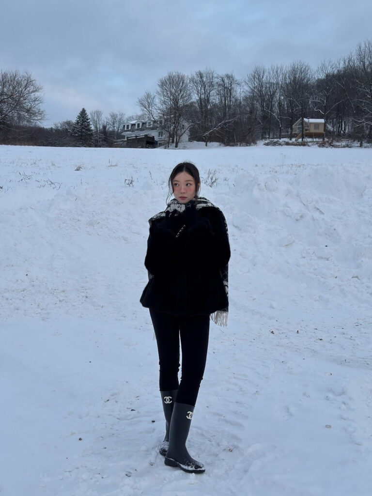 Sujin Gwon posing in a snowy forest.