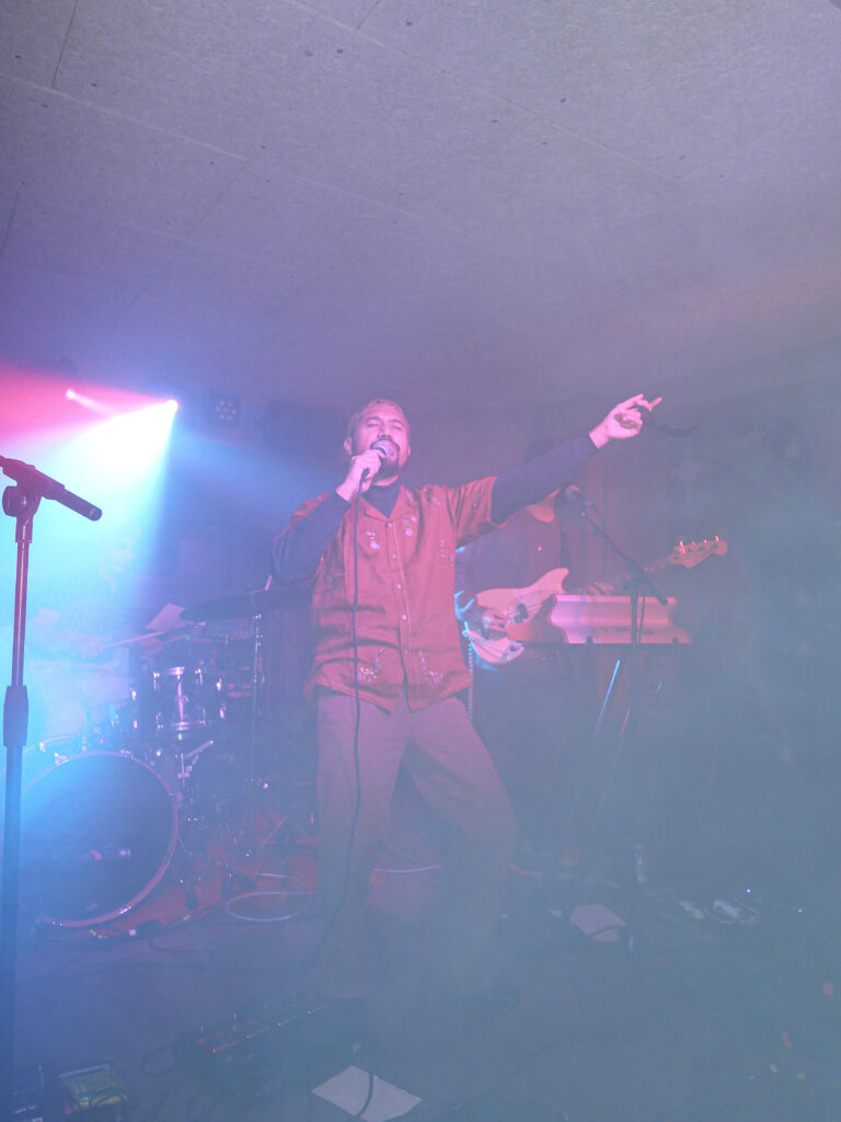 Elephant Kind performing on stage.