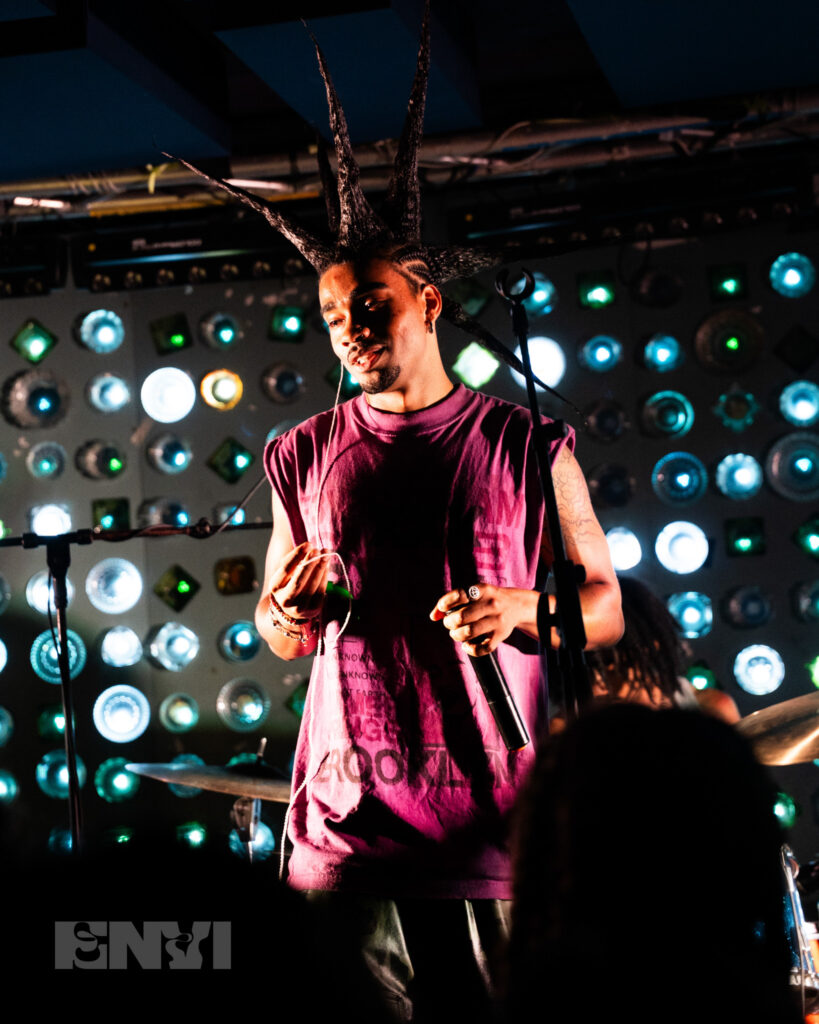 Danny Singh holds his in ears while performing at Baby’s All Right.